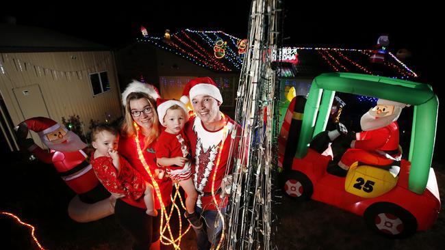 Andy and Katelyn Parsons, with Theo and Georgie are all it up for Santa’s arrival. Picture: Josh Woning