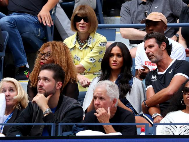 Meghan Markle at the US Open, with Vogue chief Anna Wintour sitting behind. Picture: Getty Images