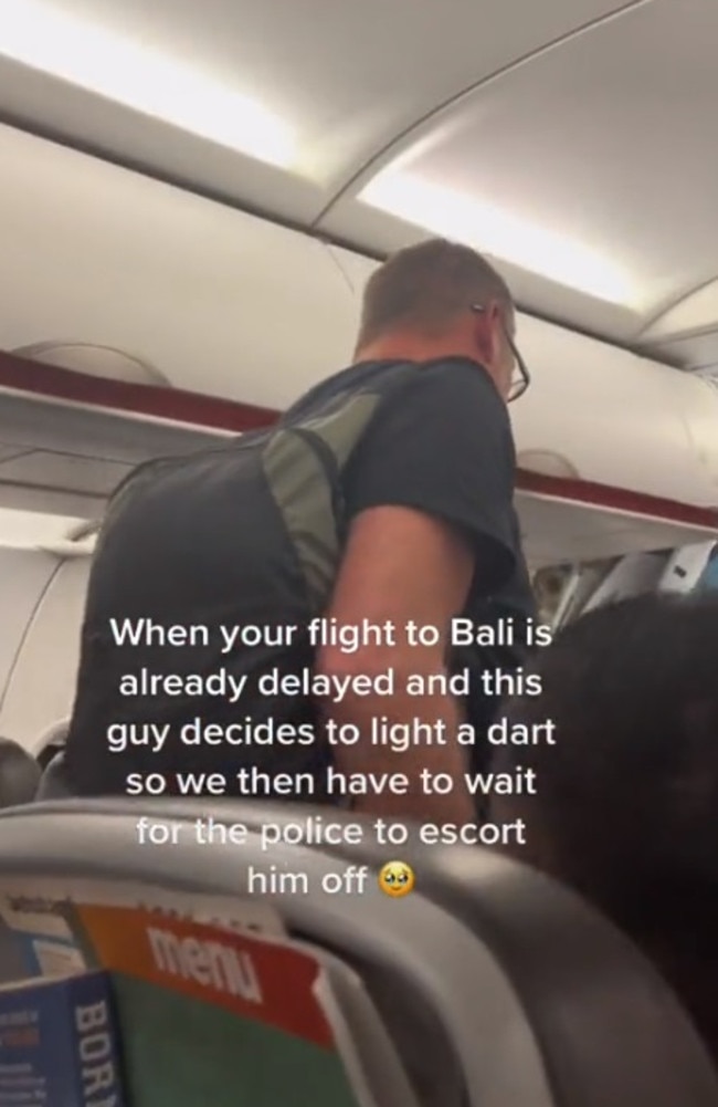 A man who lit a cigarette on a flight to Bali was escorted off. Picture: TikTok/sineadmerrett