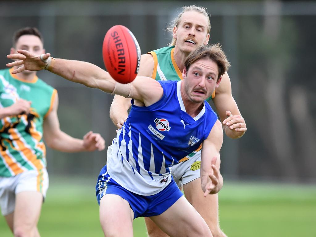 Eastern: East Ringwood James Belo keeps his eye on the ball under pressure from Sean McManus of Mooroolbark. Picture: Steve Tanner