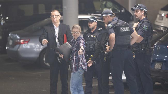 Police in the underground carpark on Greenhill Rd during initial investigations. Picture: Brett Hartwig