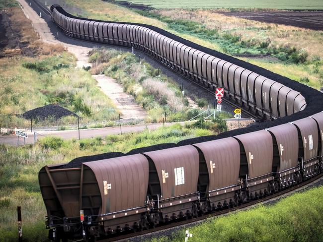 A freight train transports coal from the Gunnedah Coal Handling and Prepararation Plant, operated by Whitehaven Coal Ltd., in Gunnedah, New South Wales, Australia, on Tuesday, Oct. 13, 2020. Prime Minister Scott Morrison warned last month that if power generators don't commit to building 1,000 megawatts of gas-fired generation capacity by April to replace a coal plant set to close in 2023, the pro fossil-fuel government would do so itself. Photographer: David Gray/Bloomberg