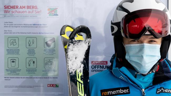 A skier next to the COVID-19 safety instructions at Pitztal glacier, Austria. Picture: AFP