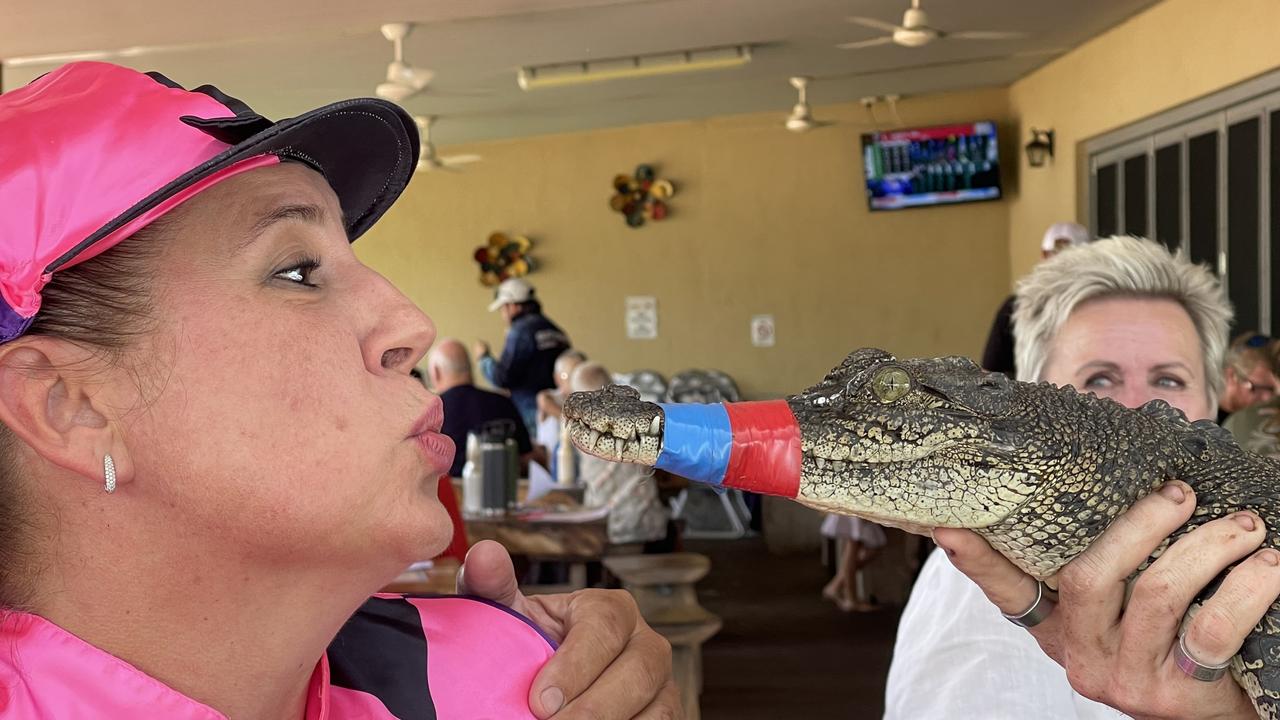 Leah Sloane with Croc-a-shit at the 2022 Berry Springs croc races. Picture: Glenn Campbell