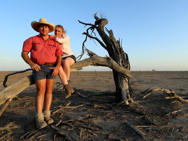 Walgett farmer Sam Evans and his girlfriend Bec Crawford on his dry property "Netherby" near Walgett. Picture: Nathan Edwards