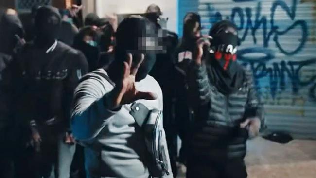 Screenshots as street gangs linked to murders and violent crimes across Brisbane boast about their brazen actions online in rap music videos, dissing other gangs which often include members as young as 12 years old. Source: YouTube