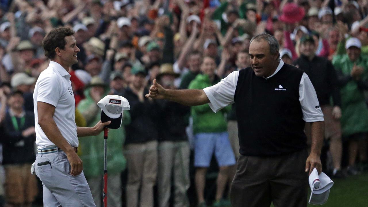 Angel Cabrera, of Argentina, gives Adam Scott, of Australia, a thumbs up