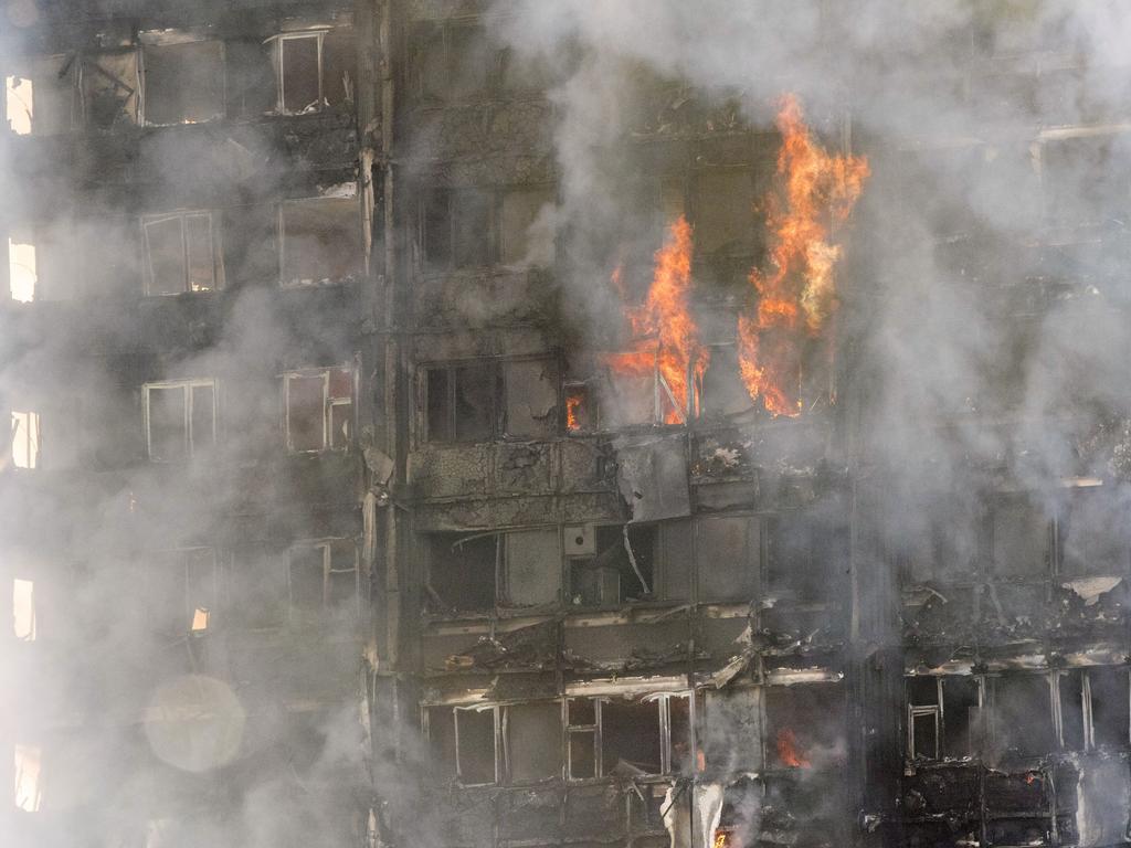 Smoke billowing from the Grenfell Tower early on June 14, 2017. Picture: Rick Findler/PA via AP