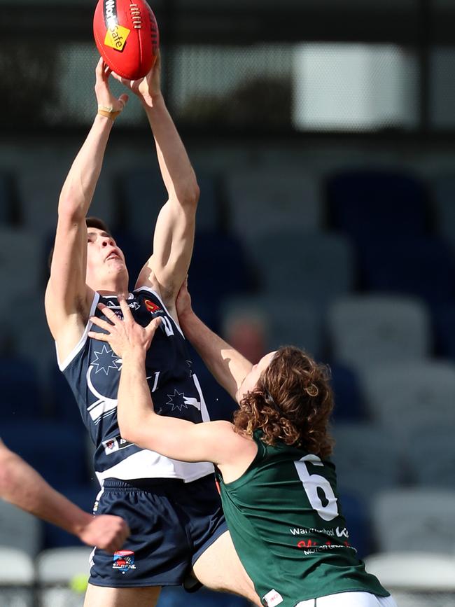 Ballarat’s Joshua Sparkman takes a strong contested mark over Hampden’s Jett Hopper. Picture Yuri Kouzmin
