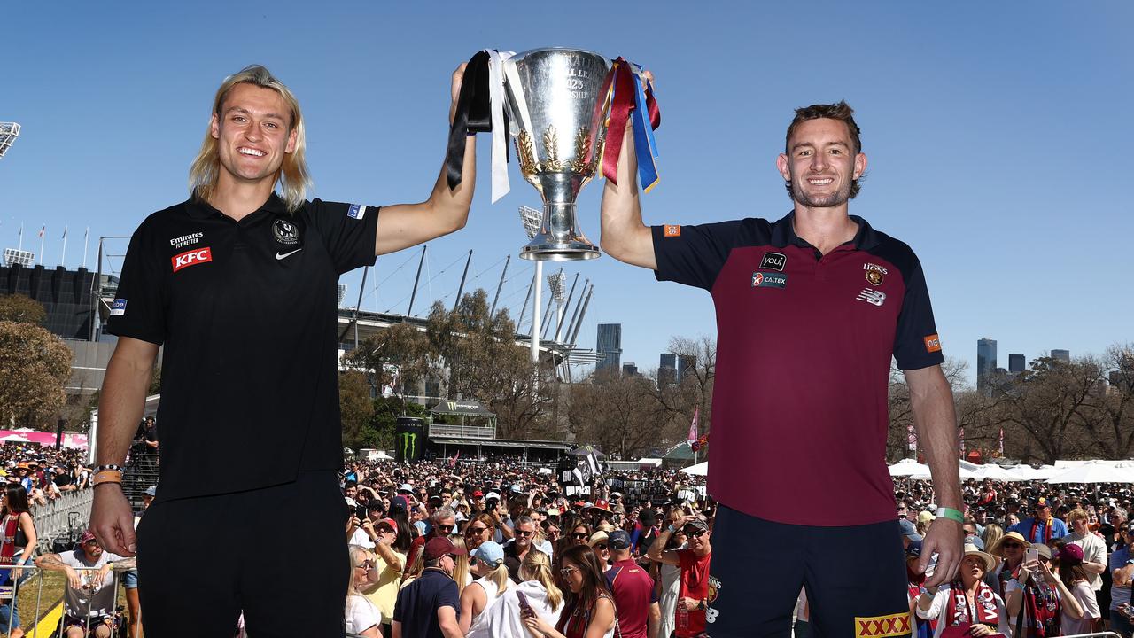 MELBOURNE . 29/09/2023. AFL . Grand Final Parade. Collingwood skipper Darcy Moore and Brisbane Lions captain Harris Andrews hold the Premiership Cup aloft after todays Parade . Pic: Michael Klein