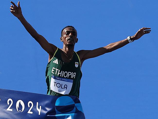 Ethiopia’s Tamirat Tola wins the men’s marathon. Picture: Getty Images