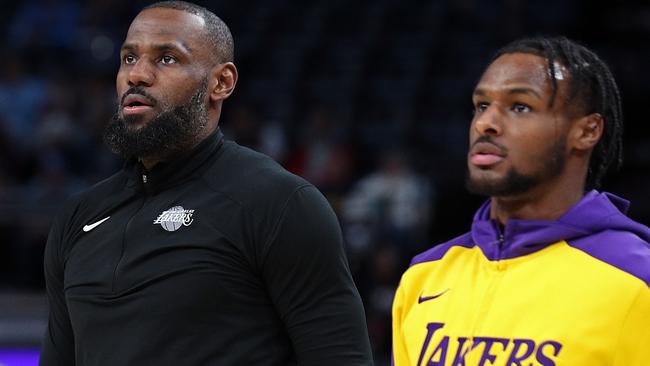 MEMPHIS, TENNESSEE - NOVEMBER 06: LeBron James #23 and Bronny James #9 of the Los Angeles Lakers look on before the game against the Memphis Grizzlies at FedExForum on November 06, 2024 in Memphis, Tennessee. NOTE TO USER: User expressly acknowledges and agrees that, by downloading and or using this photograph, User is consenting to the terms and conditions of the Getty Images License Agreement. (Photo by Justin Ford/Getty Images)