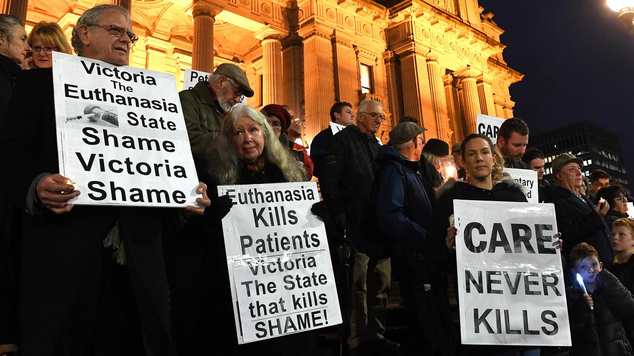 Pro-life demonstrators outside Victoria’s Parliament House on Tuesday night. Picture: AAP/James Ross