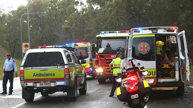 Police and emergency crews attend a vehicle involved in an accident on the Nerang-Murwillumbah road.