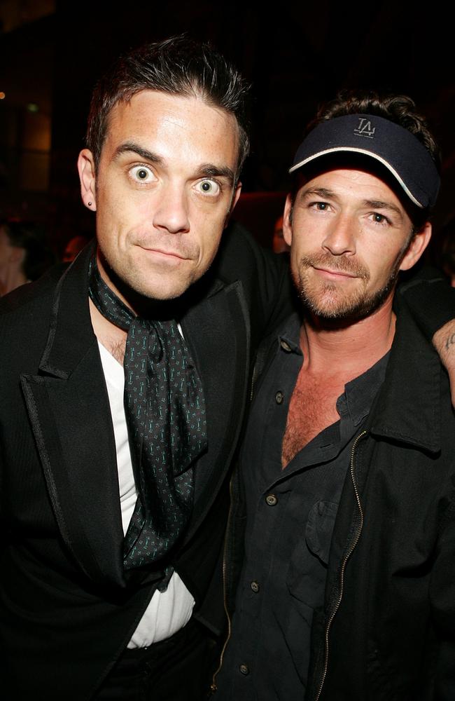 With Singer Robbie Williams in 2005. Picture: Frazer Harrison/Getty Images