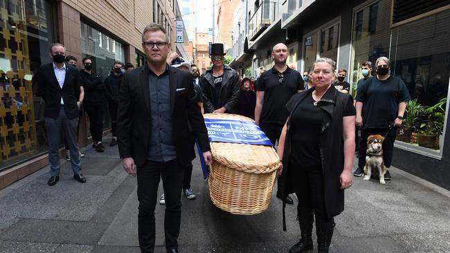 A mock funeral procession from Peel St to Hindley St, with Jason Makarenko (front left) and Simone Douglas (front right) of the Hospo Owners Collective. Picture: Tricia Watkinson