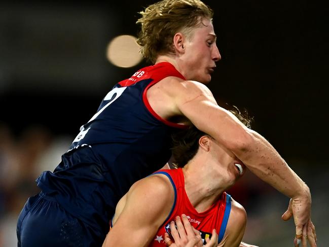 GOLD COAST, AUSTRALIA - MAY 06: Charlie Ballard of the Suns suffers an injury while challenging for the ball against Jacob van Rooyen of the Demons  during the round eight AFL match between the Gold Coast Suns and the Melbourne Demons at Heritage Bank Stadium, on May 06, 2023, in Gold Coast, Australia. (Photo by Albert Perez/AFL Photos via Getty Images)