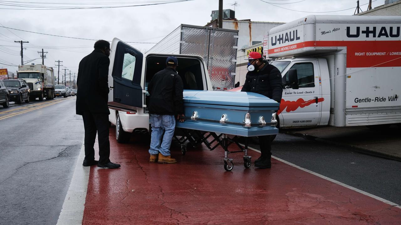 A casket is taken to a hearse from the Andrew Cleckley Funeral Home on April 30, 2020. Picture: Spencer Platt/Getty Images/AFP