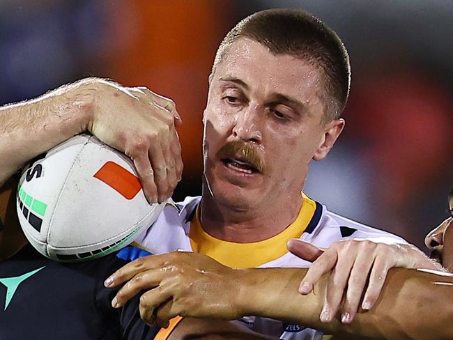 SYDNEY, AUSTRALIA - SEPTEMBER 06: Shaun Lane of the Eels is tackled during the round 27 NRL match between Wests Tigers and Parramatta Eels at Campbelltown Stadium, on September 06, 2024, in Sydney, Australia. (Photo by Jeremy Ng/Getty Images)