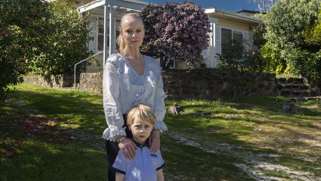 Jessica Swann and Kariym, 5, outside the home the burglars broke into. Picture: Valeriu Campan