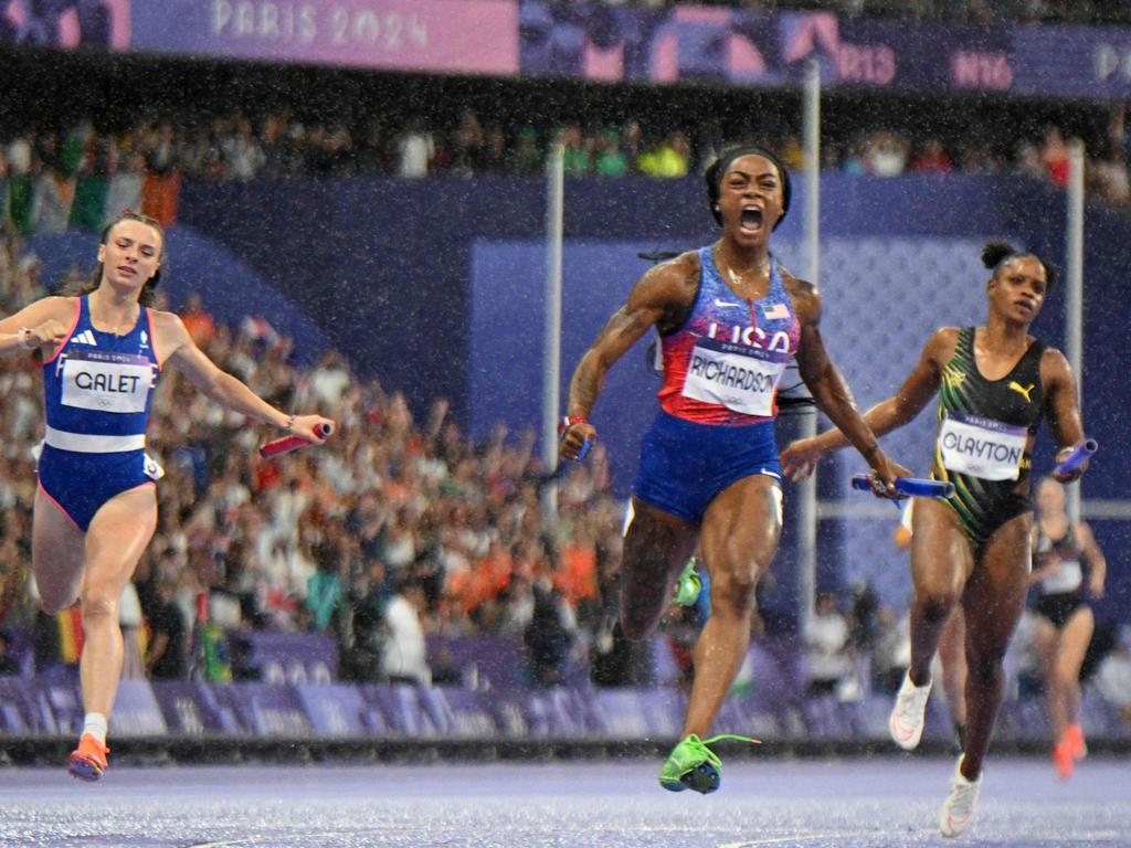 Sha'Carri Richardson crosses the finish line to win ahead of France's Chloe Galet and Jamaica's Tia Clayton in the women’s 4x100m relay. Picture: Jewel Samad / AFP