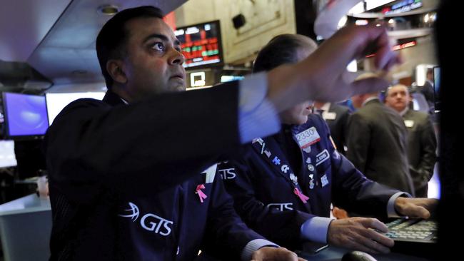 Wall Street traders watch as stocks tumble. Picture: AP