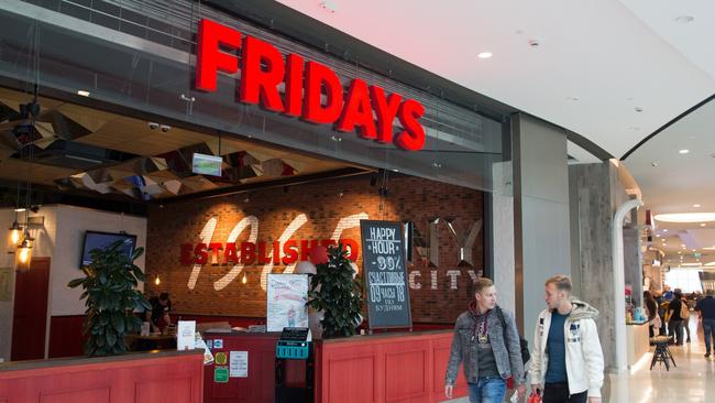 Shoppers pass by the entrance to a TGI Friday's Inc. restaurant in Moscow, Russia, on Friday, Sept. 27, 2019. McDonalds Corp. has selected Beyond Meats faux-meat patties for a plant-based burger test in Canada.  Photographer: Andrey Rudakov/Bloomberg via Getty Images