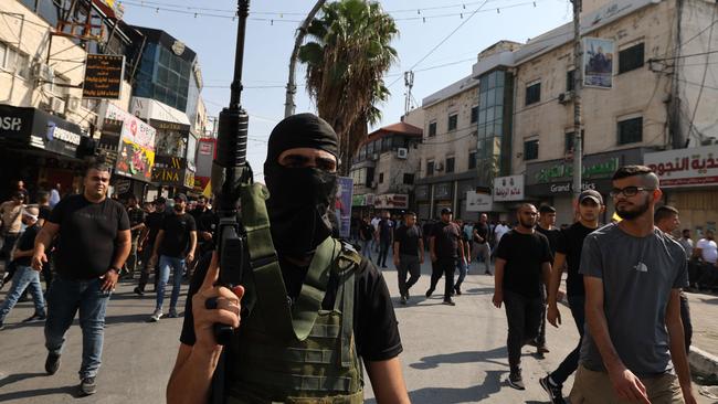 Gunmen attend the funeral of Al-Aqsa Brigades group militants reportedly killed following a morning Israeli raid on the Jenin camp for Palestinian refugees, during their funeral in Jenin in the occupied West Bank, on November 1, 2023. Picture: Jaafar Ashtiyeh/AFP