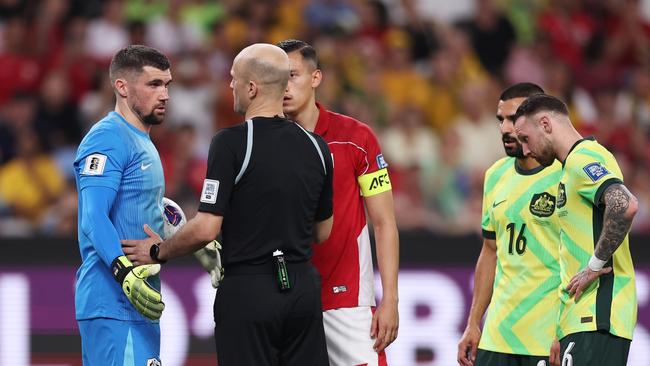 Mat Ryan (left) argues with the referee after a penalty was given to Indonesia. (Photo by Matt King/Getty Images)