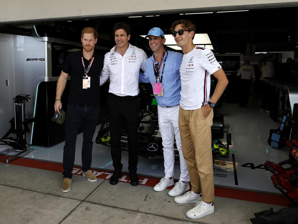 Prince Harry speaks to Mercedes GP Executive Director Toto Wolf, Alexi Robichaux and George Russell. Picture: Getty Images