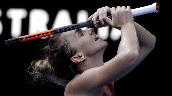 Romania's Simona Halep celebrates after defeating Germany's Angelique Kerber in their semi-final at the Australian Open. (AP Photo/Dita Alangkara)