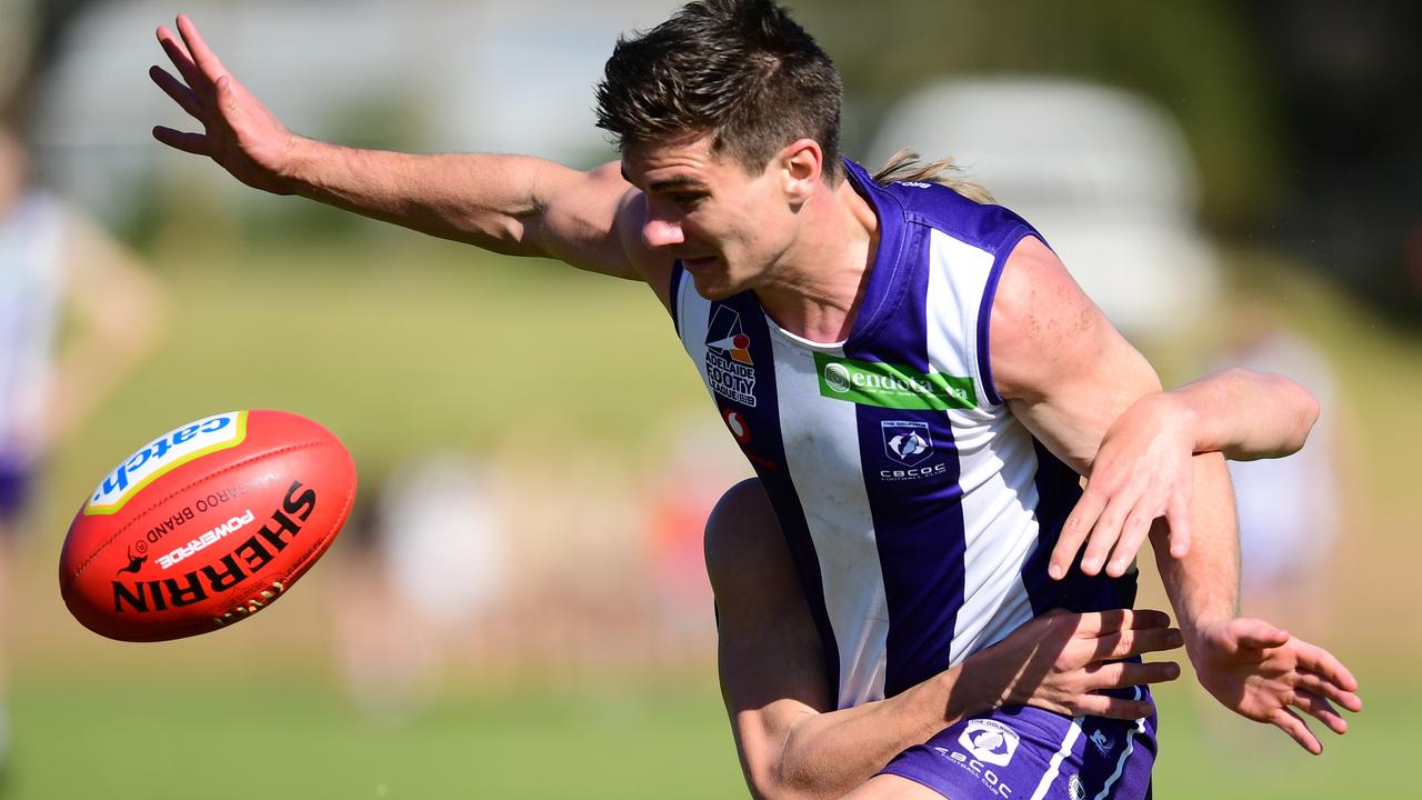 Benjamin Homburg of Edwardstown tackles Jake Johansen of CBC during the Adelaide Footy League division four grand final - CBC Old Collegians v Edwardstown at St Marys Park Saturday September 14,2019.(Image AAP/Mark Brake)