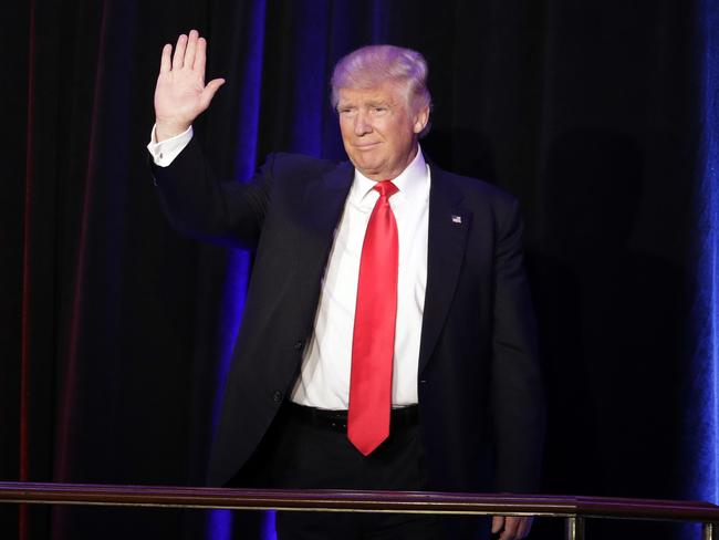 President-elect Donald Trump waves as he arrives at his election night rally. Picture: AP Photo/John Locher