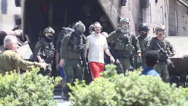 Israeli hostage Andrei Kozlov, 27, leaves a helicopter which landed in the grounds of the Sheba Medical Centre, after his rescue by the Israeli army on Saturday. Picture: AFP