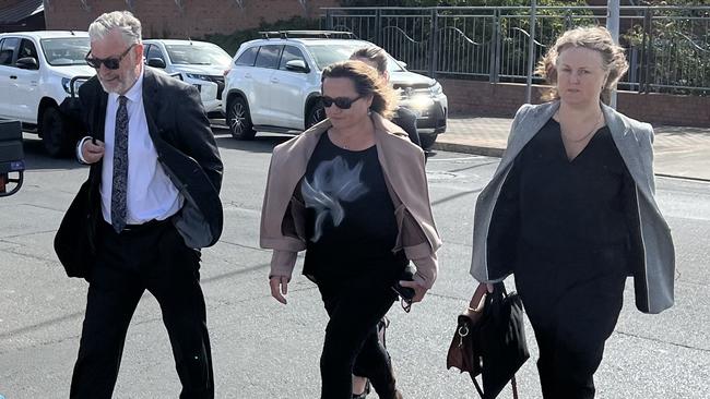 Rosemary Gamble (middle) leaving the Devonport Magistrates Court. Picture: Simon McGuire.