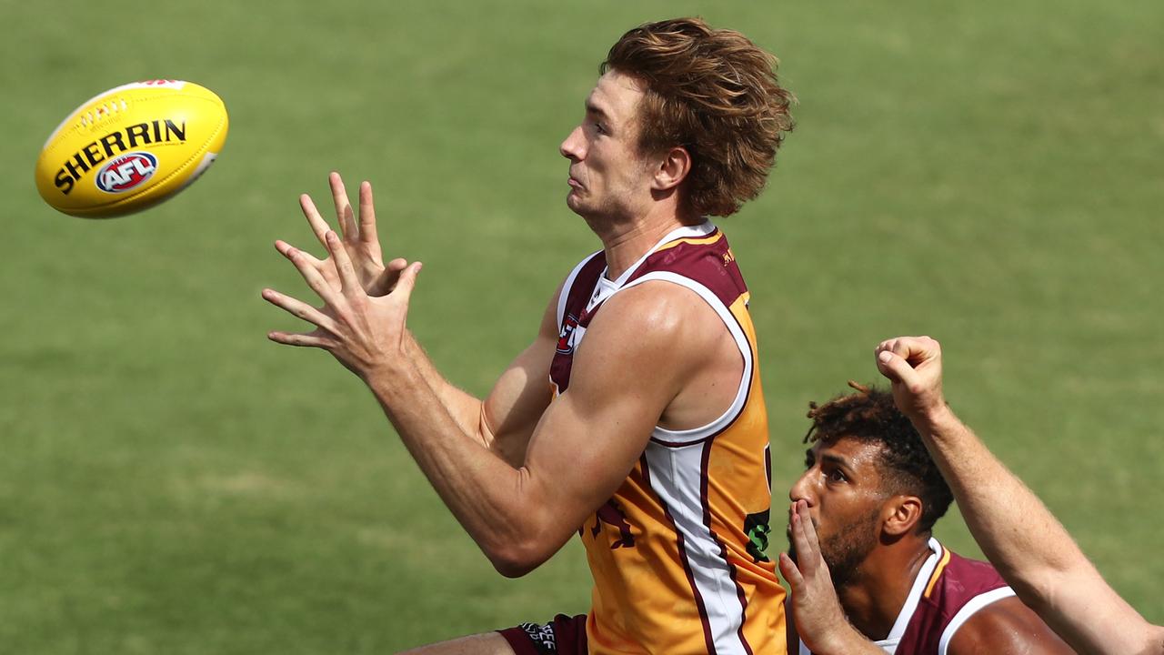 Harris Andrews marks in a pre-season practice match against the Suns.