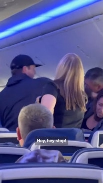 Dramatic fist fight breaks out on packed plane