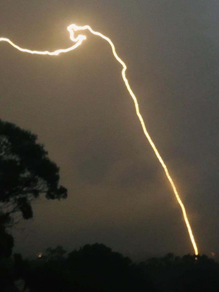 An electrical storm hit Sydney on Wednesday night and flights from Sydney Airport were suspended after an incoming flight was reportedly hit by lightning.