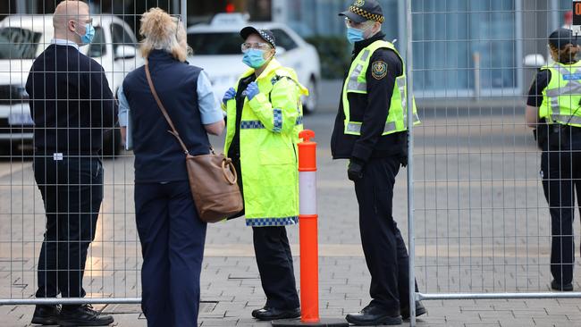 Police stand outside the Pullman Hotel in Adelaide while it is used as a Covid quarantine facility. Picture: NCA NewsWire / David Mariuz