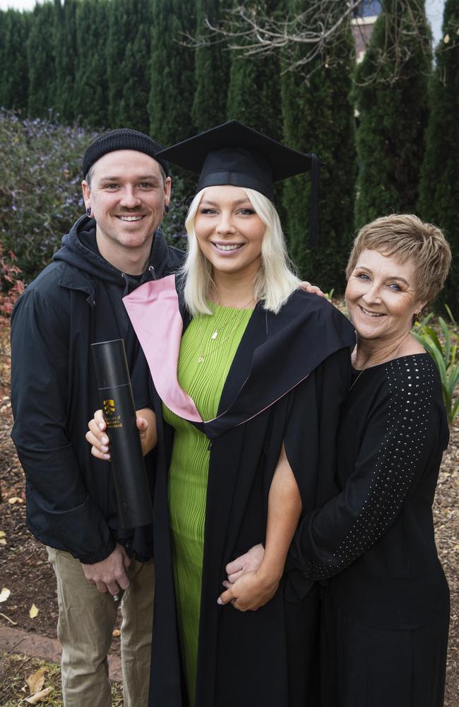 Bachelor of Education (Secondary) graduate Jade Huxham with partner Jay Medcalf and mum Tracee Shields at a UniSQ graduation ceremony at The Empire, Tuesday, June 25, 2024. Picture: Kevin Farmer