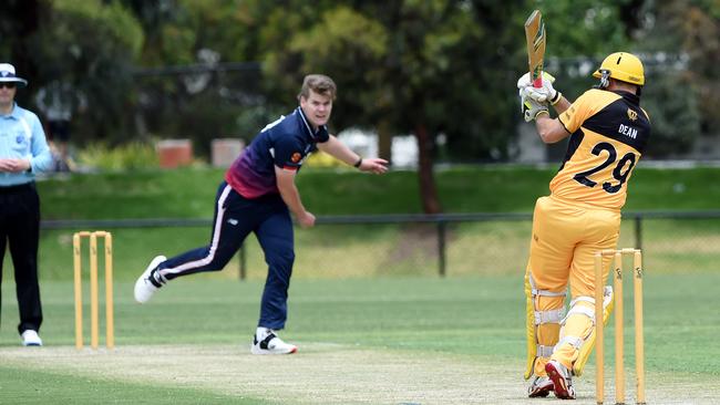 VSDCA: Yarraville’s Zachary Koch delivers to Werribee’s Shaun Dean. Picture: Steve Tanner