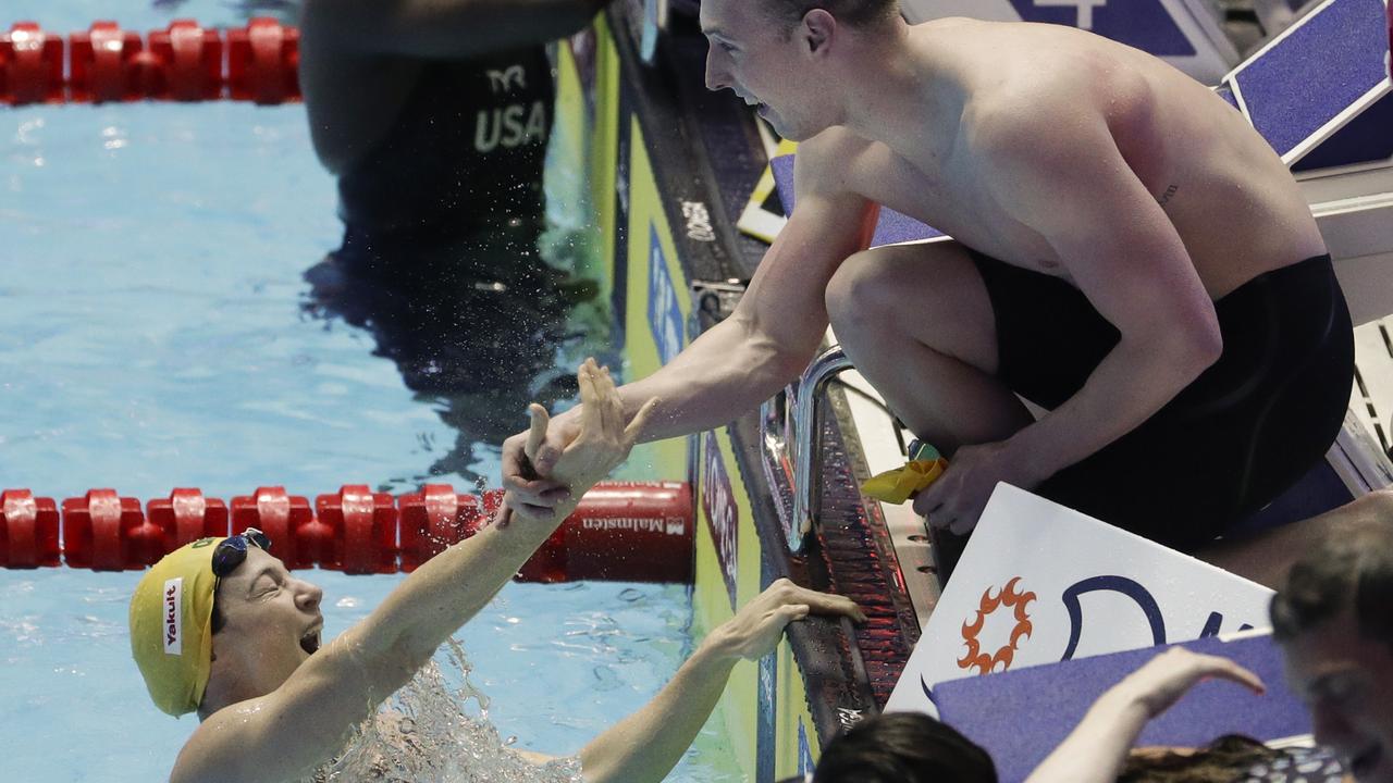 Australia's Matthew Wilson (R) congratulates Cate Campbell after the relay win.