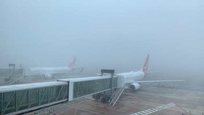 Adelaide Airport shrouded in fog on July 14, 2020. Picture: Tait Schmaal