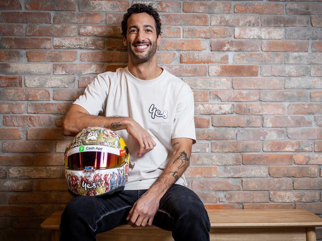 Daniel Ricciardo showcases his new helmet - designed by Victorian arts student Rosie Pattenon - which will be auctioned for children’s charity. Picture: Jake Nowakowski