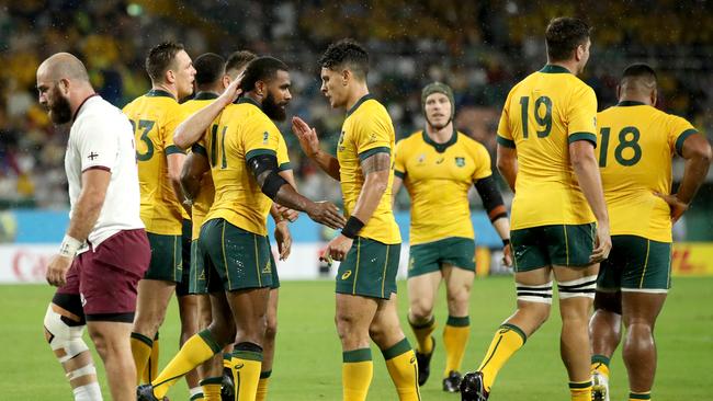 FUKUROI, JAPAN - OCTOBER 11: Marika Koroibete of Australia celebrates with teammates after scoring his team's second try during the Rugby World Cup 2019 Group D game between Australia and Georgia at Shizuoka Stadium Ecopa on October 11, 2019 in Fukuroi, Shizuoka, Japan. (Photo by Cameron Spencer/Getty Images)