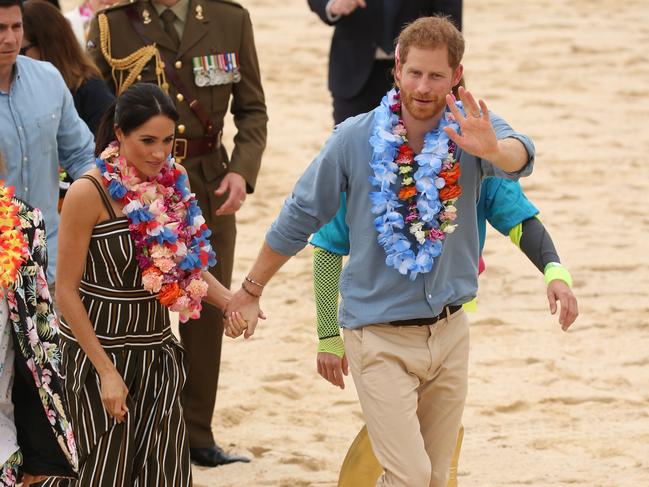 DAILY TELEGRAPH - Pictured is the Duke and Duchess of Sussex, Prince Harry and wife Meghan at Bondi Beach today on their Royal tour of Australia. Picture: Tim Hunter