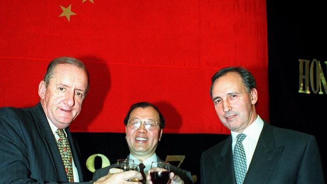 Old China hands: Paul Keating and Tim Fischer raise a glass with former Chinese Ambassador Hua Junze to celebrate Hong Kong’s handover to China in 1997. Picture: Ray Strange