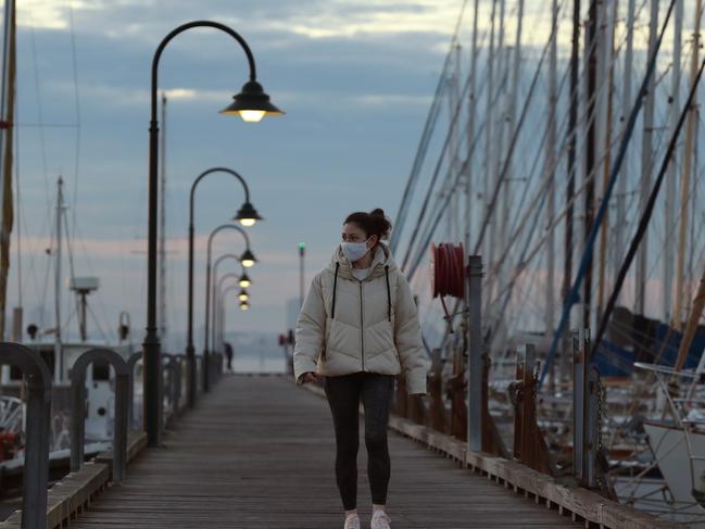 MELBOURNE, AUSTRALIA - NewsWire Photos. June 3, 2021:  People get their daily exercise as the sun comes up in Williamstown, during a COVID lockdown across Melbourne. Picture: NCA NewsWire / David Crosling