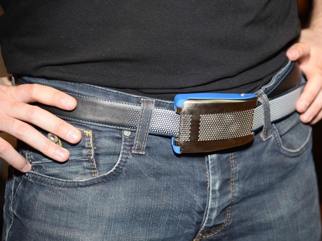 Emiota representative Johann Gobba wears Belty, a smart belt from Paris-based Emiota, at CES Unveiled, at the 2015 Consumer Electronics Show media preview day, January 4, 2015 in Las Vegas, Nevada. Belty, the world’s first connected belt, monitors the wearer’s waistline measurements and advises when it is time to lose weight. Belty will also automatically loosen when the wearer sits and tighten when the wearer stands. Belty is made entirely in France - a wearable tech item that is also a fashion statement. The product is still under development but Emiota co-founder expects to have Belty on the market by Q4 at a price yet to be determined. 2015 International CES, the world's largest showcase for the latest in consumer electronics, runs on January 6-9, with media preview days on January 4 and 5. AFP PHOTO / ROBYN BECK