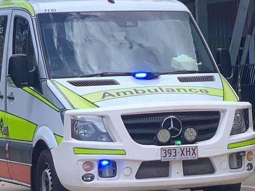 Emergency services attend to a patient at Townsville Community Learning Centre